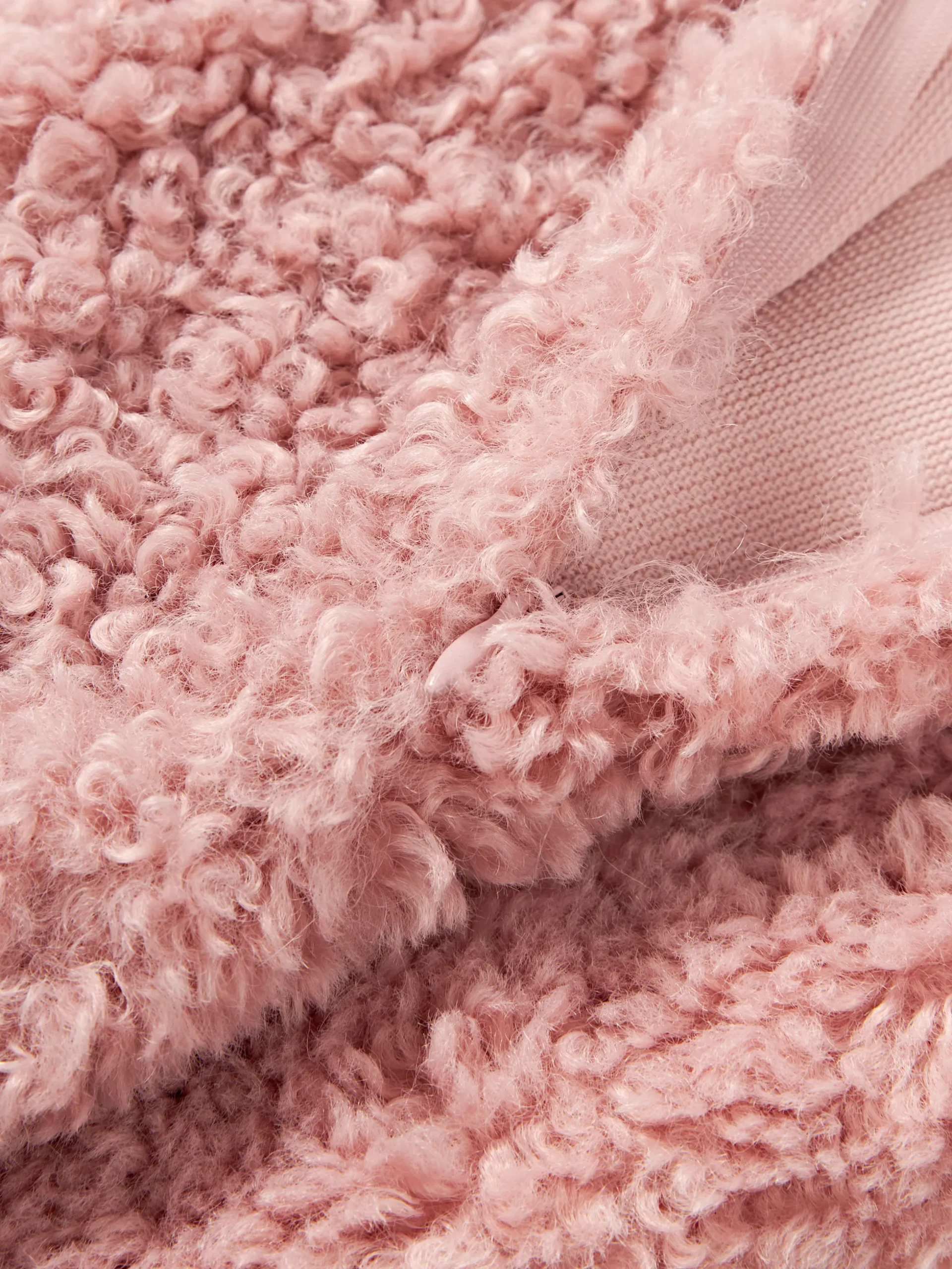 Copricuscino in teddy Dotty