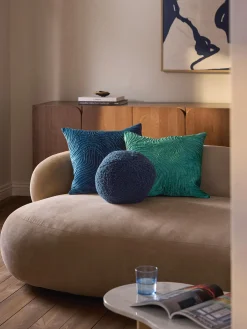 Cuscino decorativo rotondo in tessuto teddy Dotty