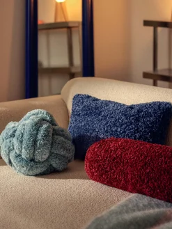 Cuscino annodato in teddy Dotty