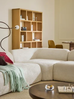 Divano angolare componibile 4 posti con chaise longue in teddy bouclé Wolke