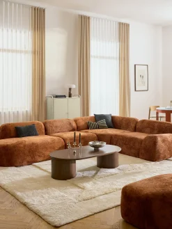 Divano angolare componibile 4 posti con chaise longue in teddy bouclé Wolke
