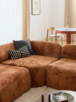 Divano angolare componibile 4 posti con chaise longue in teddy bouclé Wolke