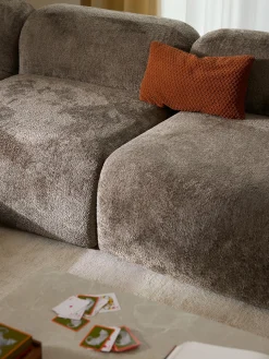 Divano angolare componibile 4 posti in teddy bouclé con chaise longue Wolke