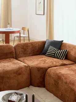 Divano angolare componibile 4 posti con chaise longue in teddy bouclé Wolke