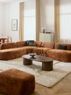 Divano angolare componibile 4 posti con chaise longue in teddy bouclé Wolke