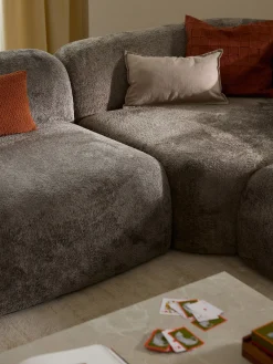 Divano angolare componibile 4 posti in teddy bouclé con chaise longue Wolke