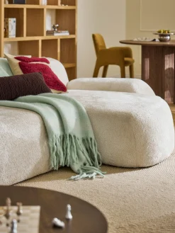 Divano angolare componibile 4 posti con chaise longue in teddy bouclé Wolke