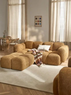 Divano componibile 3 posti in teddy-bouclé con poggiapiedi (sinistra/destra) Tayla