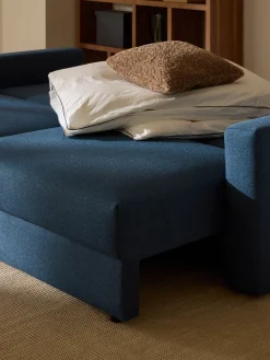 Divano letto 3 posti in bouclé con vano contenitore Tasha