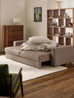 Divano letto 3 posti in bouclé con vano contenitore Tasha