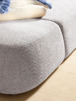 Divano letto angolare in teddy-bouclé con contenitore Pao