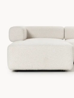 Divano componibile grande in bouclé con poggiapiedi Anton (sinistra/destra)