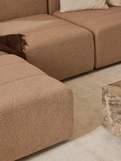 Divano componibile 4 posti in bouclé con poggiapiedi (sinistra/destra) Lena