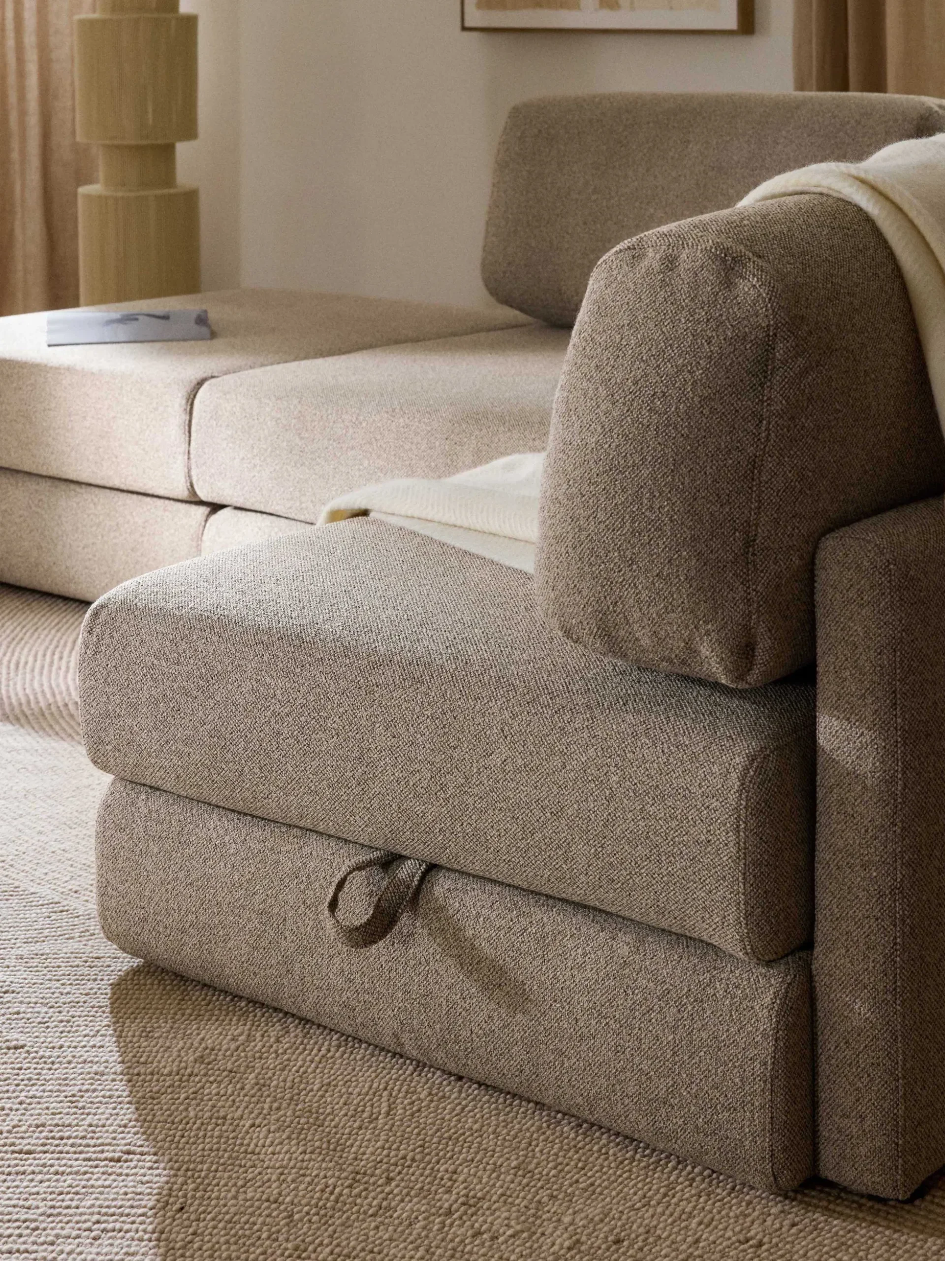 Divano letto angolare in bouclé con contenitore Ladina