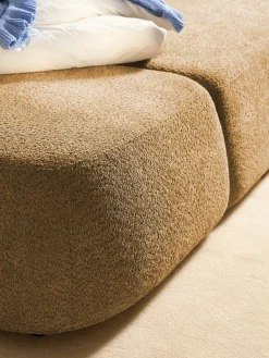 Divano letto angolare in teddy-bouclé con contenitore Pao