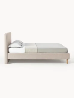 Letto imbottito con piedini in legno Giulia