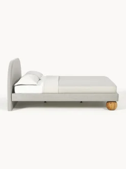 Letto imbottito con piedini rotondi in legno di quercia Rena