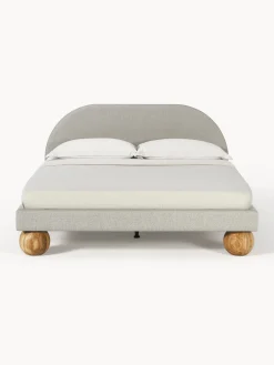 Letto imbottito con piedini rotondi in legno di quercia Rena