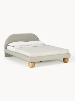 Letto imbottito con piedini rotondi in legno di quercia Rena