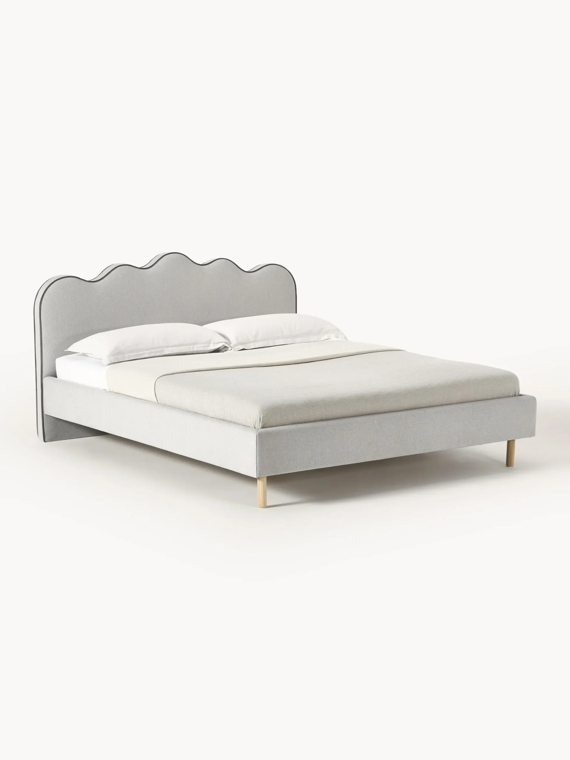 Letto imbottito con testiera ondulata Romy