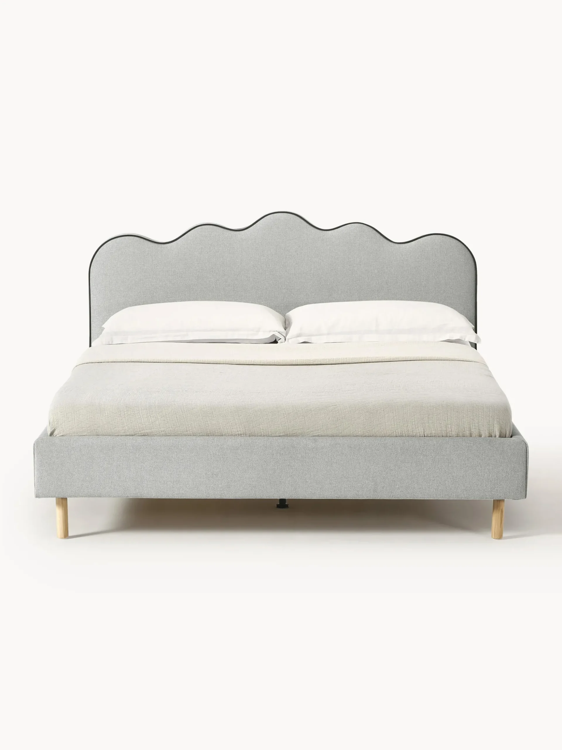 Letto imbottito con testiera ondulata Romy