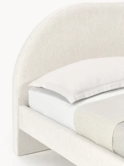 Letto imbottito con piedini rotondi in legno di quercia Rena