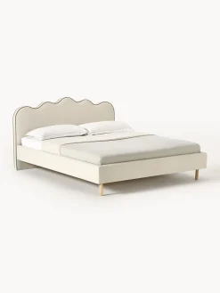 Letto imbottito con testiera ondulata Romy