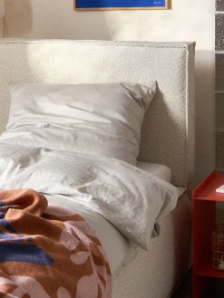 Letto singolo imbottito in bouclé con contenitore Dream