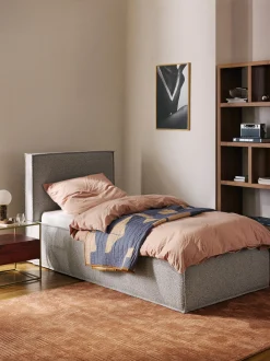 Letto singolo imbottito in bouclé con contenitore Dream