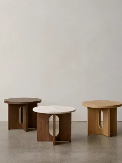 Tavolino rotondo in legno con piano in arenaria Androgyne